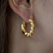 Load image into Gallery viewer, Twisting Gold Hoop Earring
